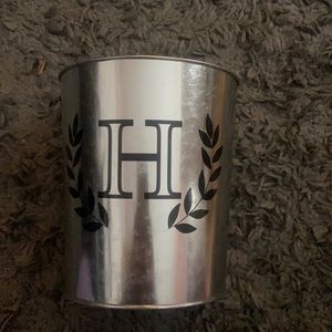 silver bin with an H on it